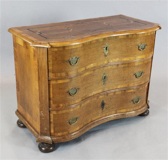 A 19th century inlaid oak serpentine commode, W.3ft 10in. D.1ft 10in. H.2ft 9in.